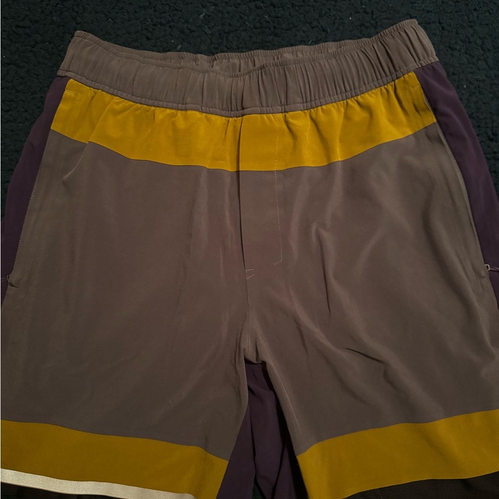 Lululemon Athletica Purple and Gold Lined Shorts